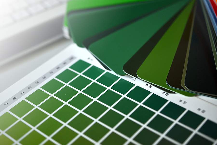 collection of ral colours on wooden background. colored paper